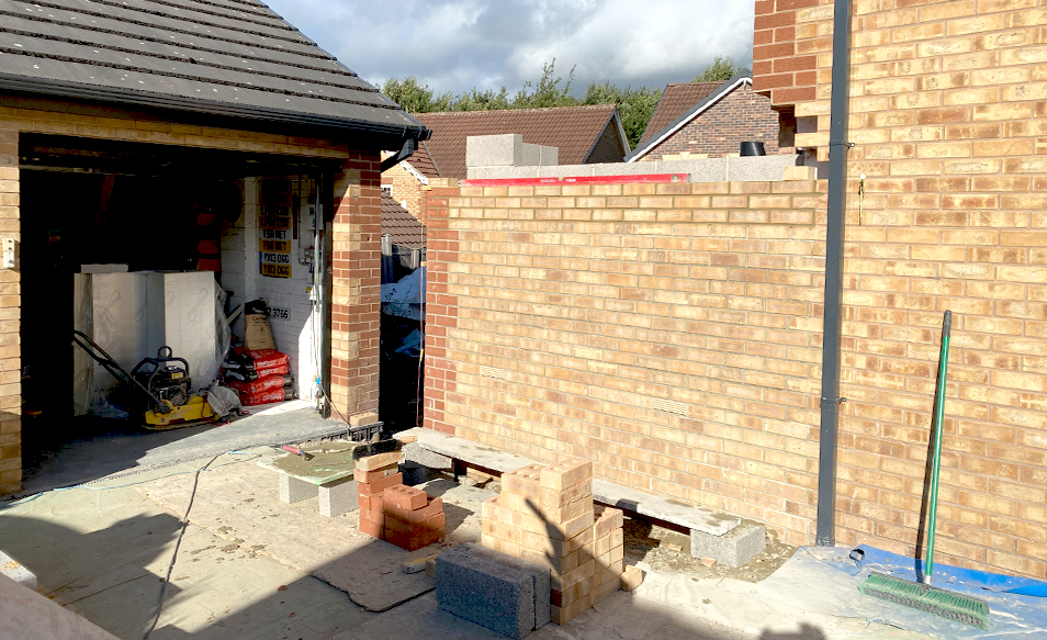 image of a buff facing brick wall construction extension